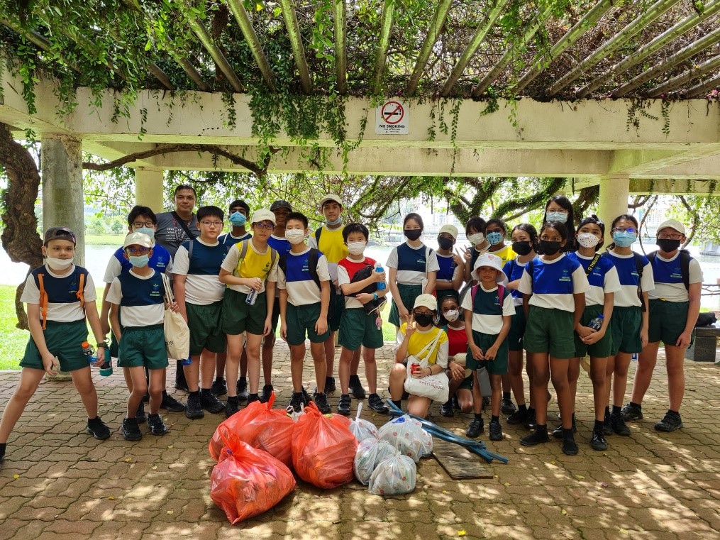 Pupils posing with their collection after the litter picking activity.